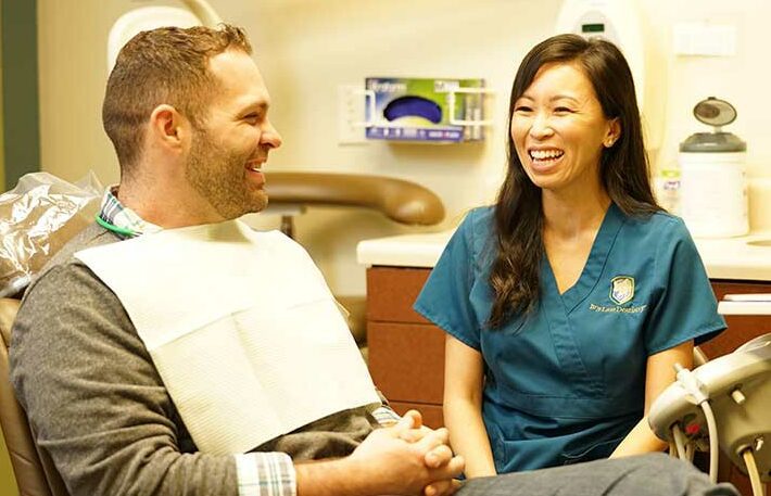 Image of dentist with patient. Ivy Lane Dentistry offers general dentistry services in Terrell Hills, TX and all of San Antonio, TX.