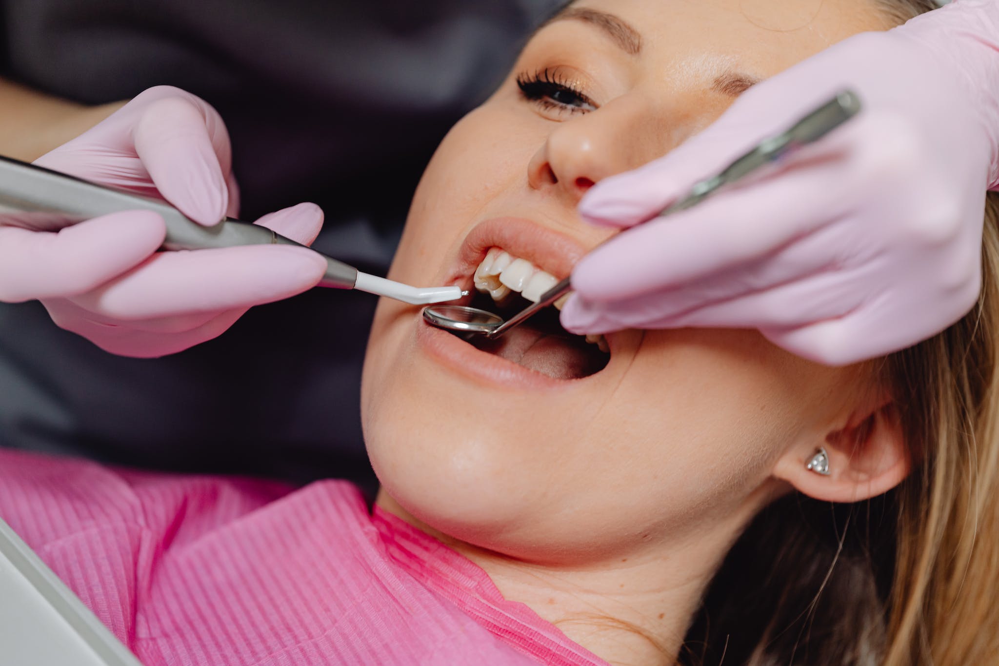 Photo of a Woman Getting a Dental Check Up. Ivy Lane Dentistry offers teeth cleaning in San Antonio, TX