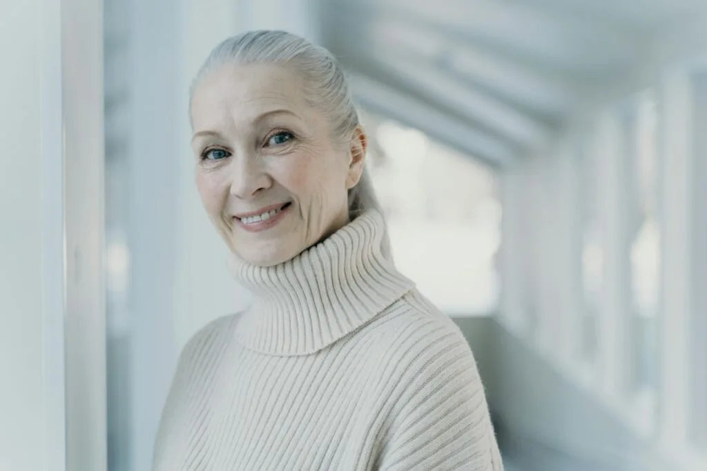 Smiling woman with dental bridge from Ivy Lane Dentistry